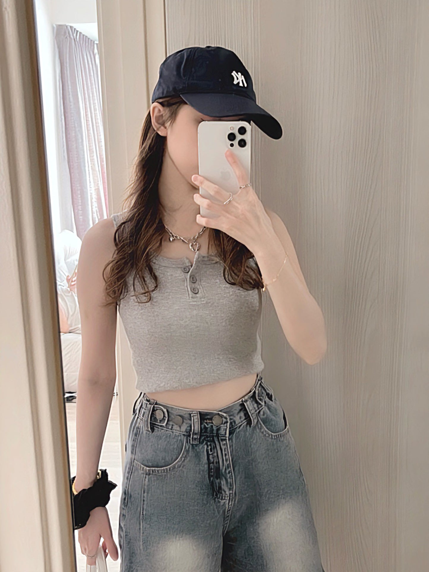 SLEEVELESS BUTTON-UP CROP TOP