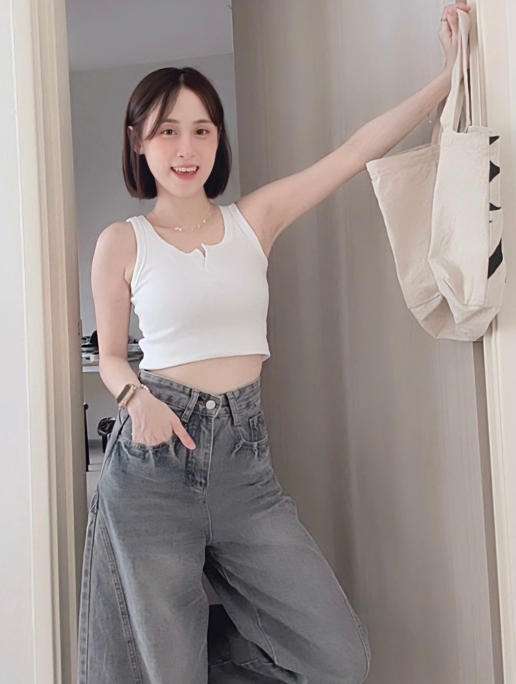 SLEEVELESS BUTTON-UP CROP TOP