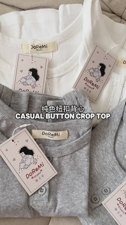 SLEEVELESS BUTTON-UP CROP TOP